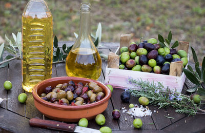 Various fruits in container on table