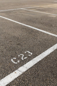 High angle view of arrow sign on road