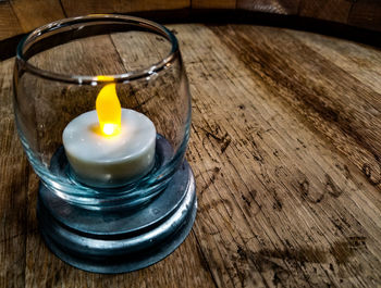 Close-up of lit tea light on table