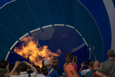 Group of people looking at fire