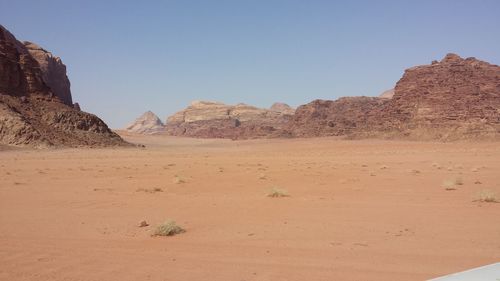 Scenic view of desert against clear sky