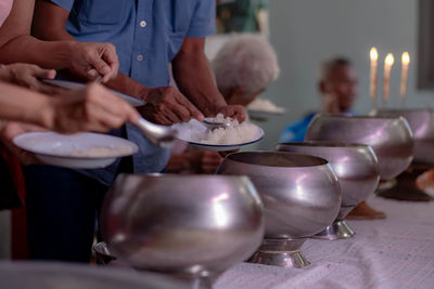 Close-up of people holding food