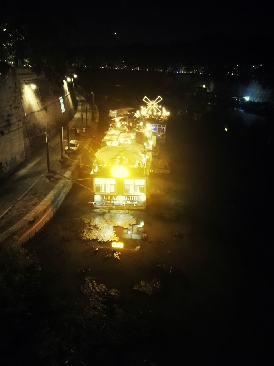 ILLUMINATED STREET LIGHTS AT NIGHT