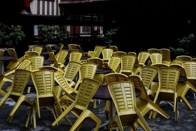 Empty chairs and tables in cafe