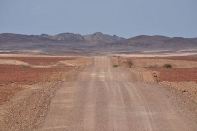 Country road leading towards mountains