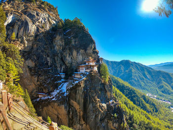 Scenic view of mountains against blue sky