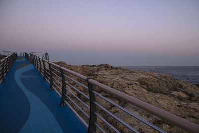 Scenic view of sea against clear sky during sunset