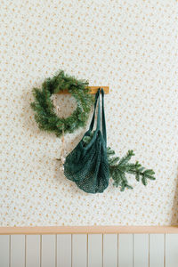 Christmas decor in the living room in the scandinavian style.  wreath of fir branches 