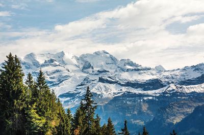 Scenic view of snowcapped mountains against sky