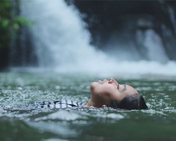 Young woman in river