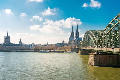 Bridge over river with buildings in background