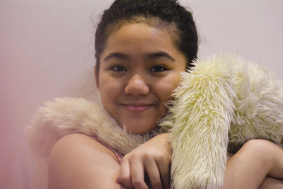 Close-up portrait of smiling woman at home