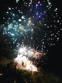 Firework display at night