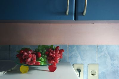 Fresh fruits on counter below cabinet in kitchen at home