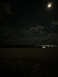 Scenic view of sea against sky at night