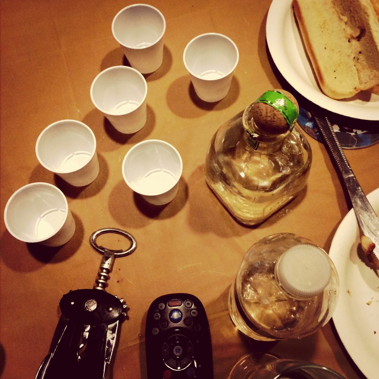 indoors, food and drink, table, still life, drink, plate, high angle view, food, freshness, large group of objects, drinking glass, variation, refreshment, spoon, arrangement, fork, directly above, bowl, ready-to-eat, no people