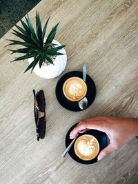 High angle view of coffee cup on table