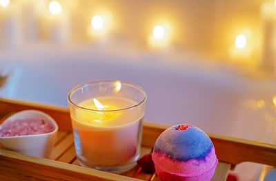 Spiritual aura cleansing flower bath for full moon ritual with bath bomb, candles, aroma salt.