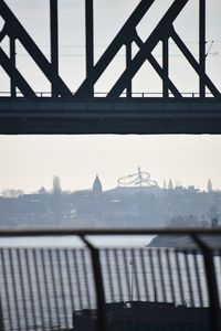 Bridge against sky seen through window