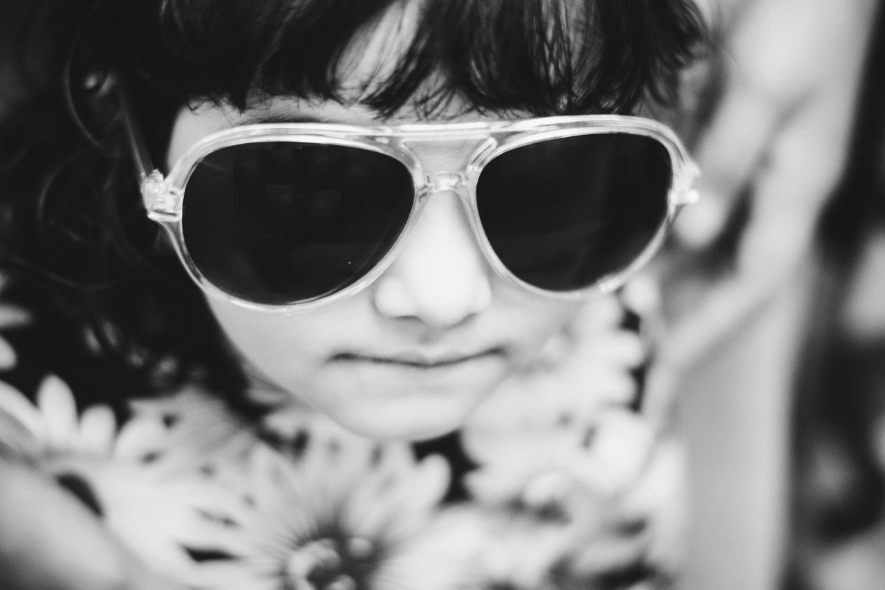 sunglasses, looking at camera, portrait, one person, headshot, close-up, day, real people, people, one woman only, adults only, adult, young adult, outdoors