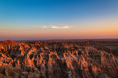 Scenic view of mountains against sky during sunset