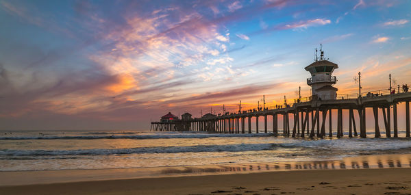 Scenic view of beach against sky during sunset