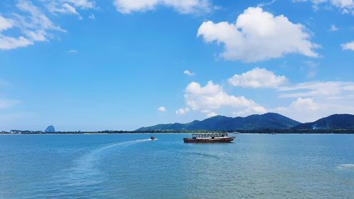 Scenic view of sea against blue sky