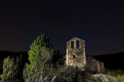 Historic building against sky at night