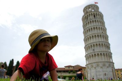 Boy by leaning tower of pisa