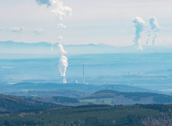 Smoking coal-fired power plant and steam above  cooling tower. ecological environmental problem