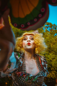 Young woman looking up