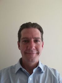 Portrait of smiling man against white background