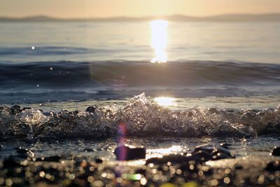 Scenic view of sea at sunset