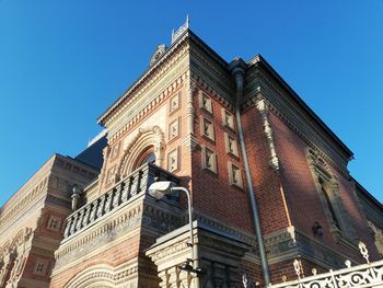 Low angle view of building against clear blue sky