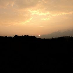 Scenic view of silhouette landscape against sky during sunset
