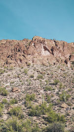 Scenic view of rocky mountains against clear blue sky