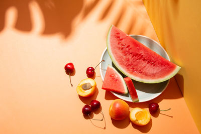 High angle view of fruits in plate on table