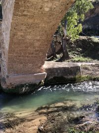 View of water flowing through rock