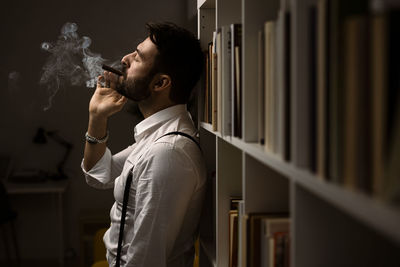 Young man smoking cigarette