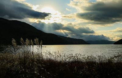 Scenic view of silhouette mountain against sky during sunset