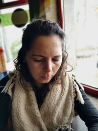 Woman looking down in restaurant