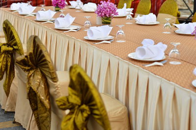 Close-up of arranged dining table at wedding ceremony