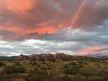 Scenic view of landscape against dramatic sky