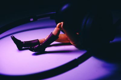 High angle view of woman playing on purple