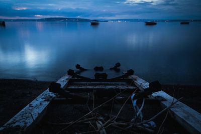 Jetty on lake against sky