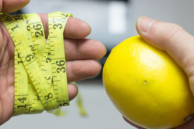 Close-up of hand holding fruit