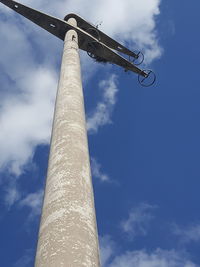 Low angle view of column against blue sky