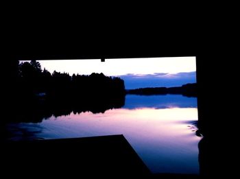 Scenic view of calm lake at sunset