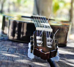 Close-up of guitar on table