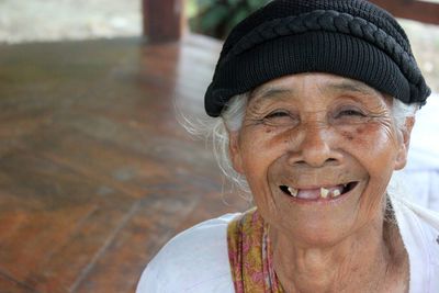 Close-up portrait of smiling senior woman